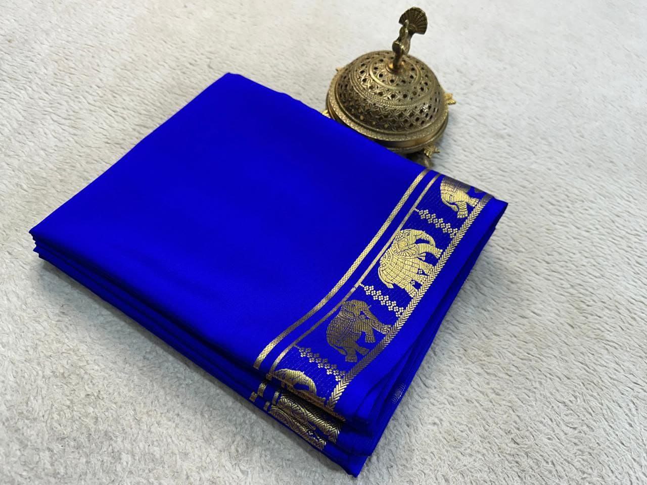 Blue fabric with gold elephant patterns on a white background